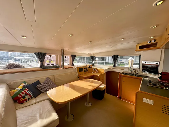 Selkie Yacht Photos Pics Interior of 2012 Lagoon 400 catamaran with modern kitchen and cozy seating area.