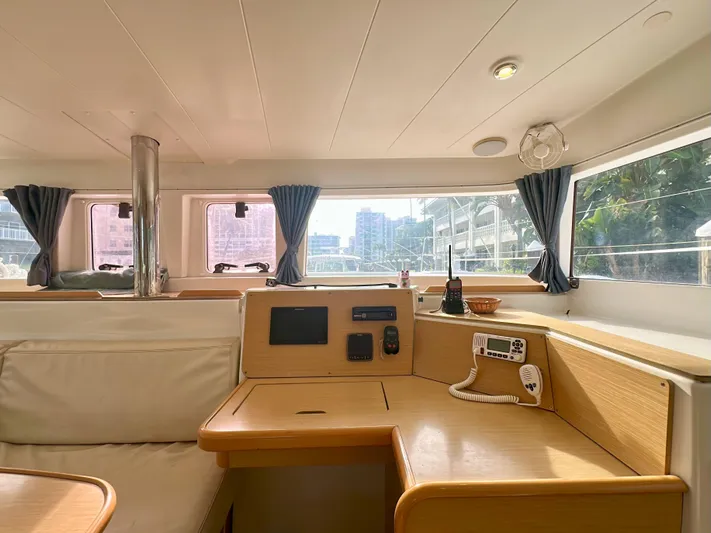 Selkie Yacht Photos Pics Interior of 2012 Lagoon 400 catamaran with navigation station and panoramic windows.