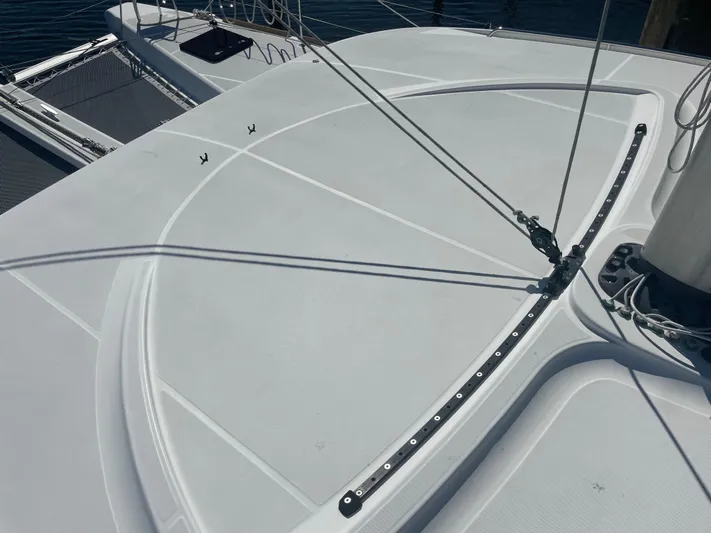 Sun Bums Yacht Photos Pics 2017 Lagoon 39 catamaran deck with rigging and netting, showcasing sleek design.