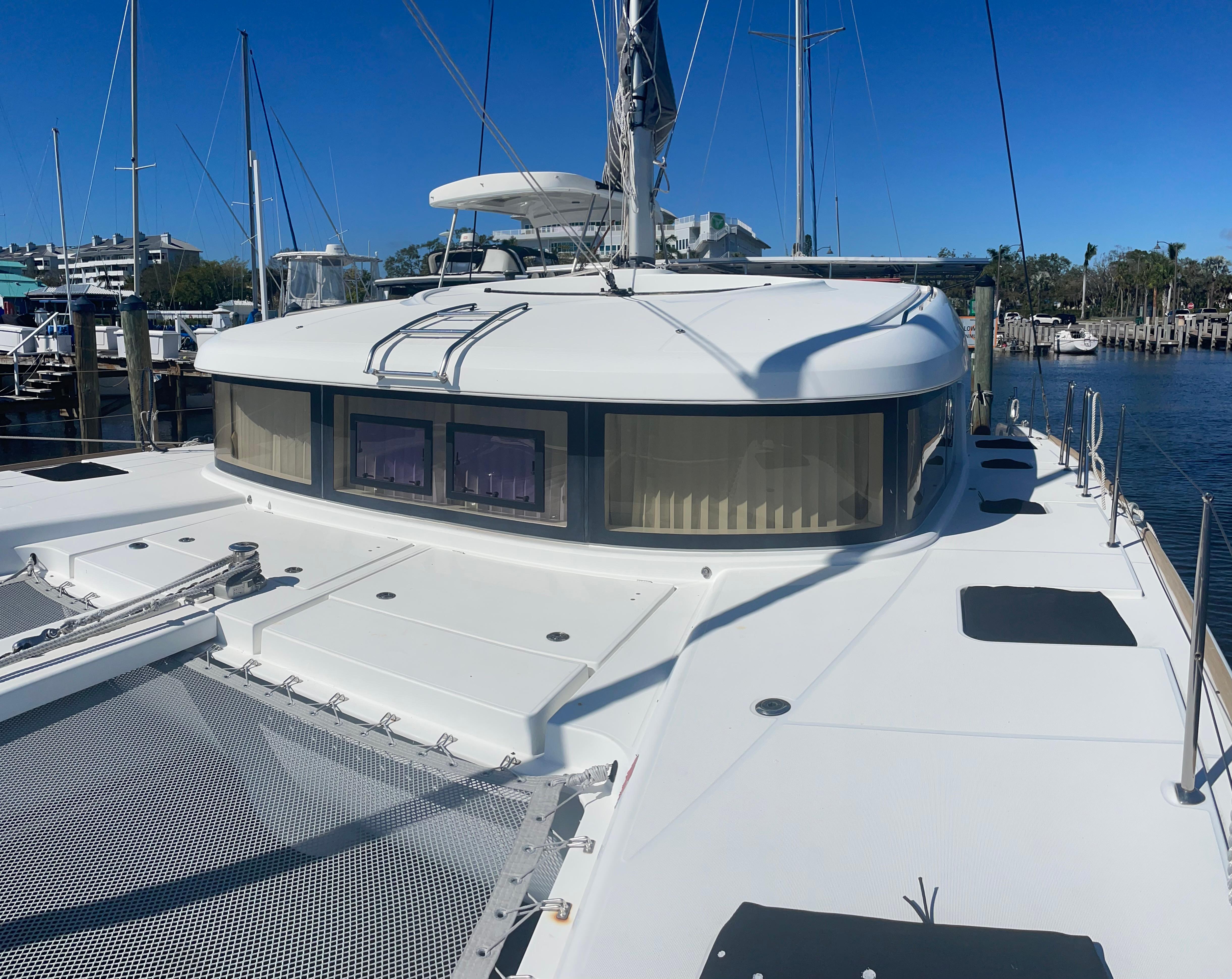 2017 Lagoon 39 catamaran docked, showcasing spacious deck and sleek design.