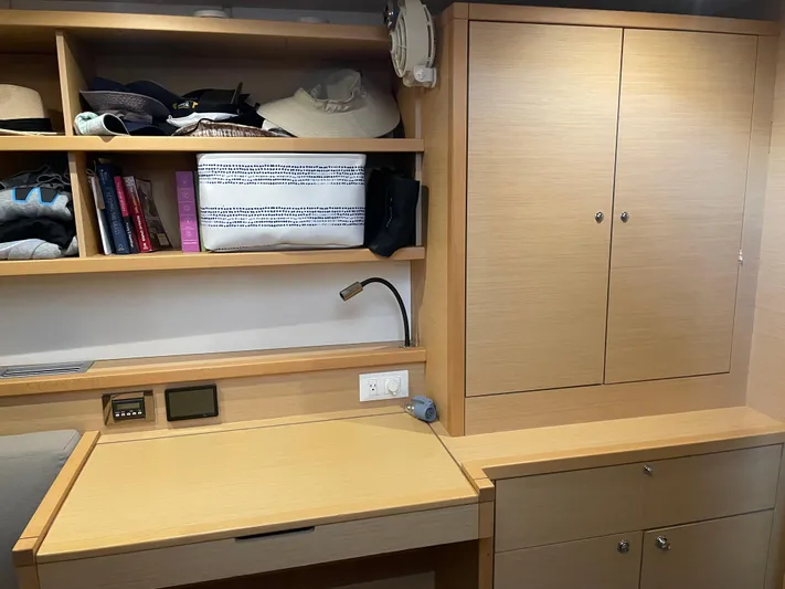 Sun Bums Yacht Photos Pics Interior of 2017 Lagoon 39 yacht with wooden shelves and desk.