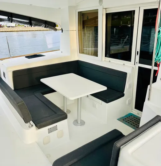 Sun Bums Yacht Photos Pics 2017 Lagoon 39 yacht interior with sleek seating and table by the water.