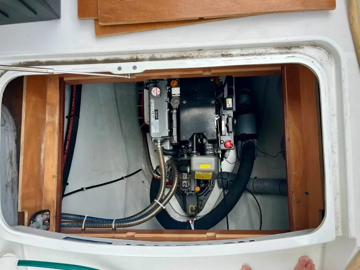 Sun Bums Yacht Photos Pics Engine compartment of a 2017 Lagoon 39 catamaran, showcasing mechanical components and wiring.
