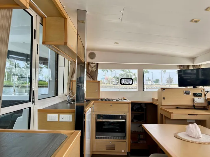 Sun Bums Yacht Photos Pics Interior of 2017 Lagoon 39 catamaran, featuring modern kitchen and dining area.