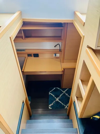 Sun Bums Yacht Photos Pics Interior of 2017 Lagoon 39 yacht with wooden cabinetry and compact workspace.