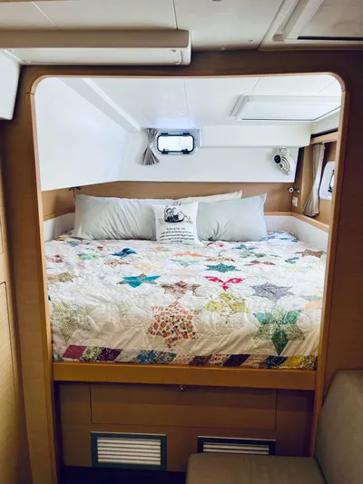 Sun Bums Yacht Photos Pics Cozy bedroom in 2017 Lagoon 39 catamaran with colorful quilt and modern design.