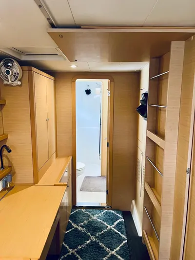 Sun Bums Yacht Photos Pics Interior of 2017 Lagoon 39 catamaran featuring modern wood cabinetry and compact bathroom.