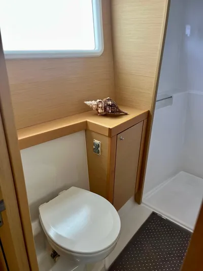Sun Bums Yacht Photos Pics 2017 Lagoon 39 yacht bathroom with modern fixtures and decorative seashells.