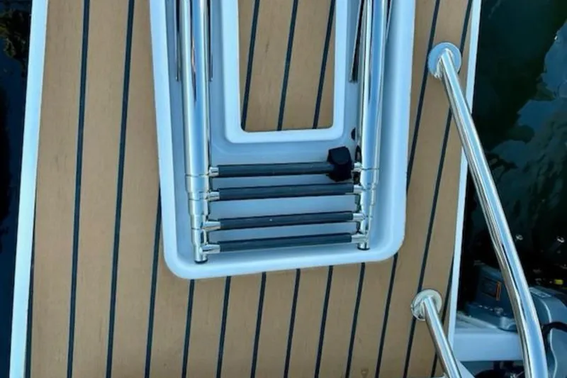  Yacht Photos Pics 2024 Beneteau Antares 9 swim platform with retractable ladder and teak decking.