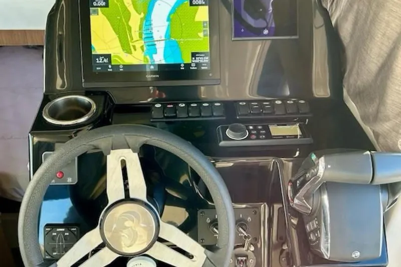  Yacht Photos Pics 2024 Beneteau Antares 9 helm with navigation display and controls.