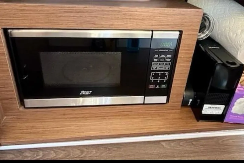  Yacht Photos Pics Microwave and coffee machine in 2024 Beneteau Antares 9 kitchen area.