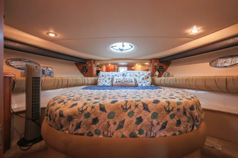 My Gypsy Soul Yacht Photos Pics Luxurious 2004 Meridian 411 Sedan cabin with nautical-themed bedding and ambient lighting.