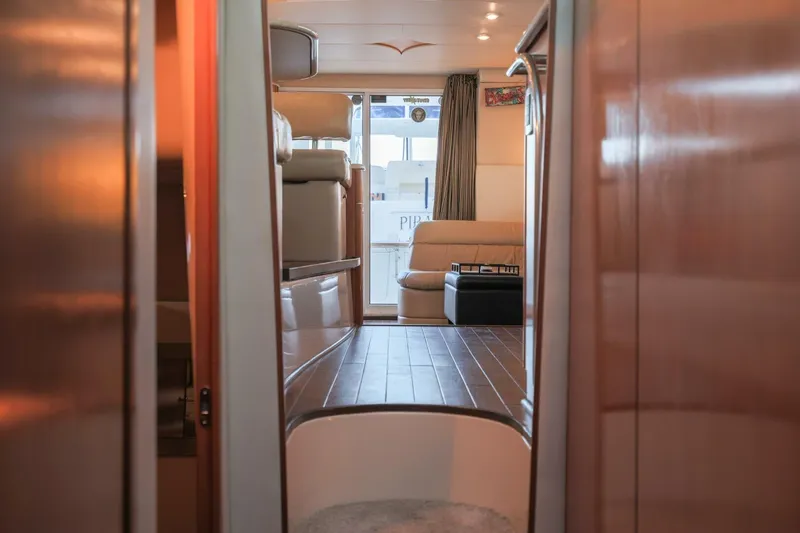 My Gypsy Soul Yacht Photos Pics Interior view of 2004 Meridian 411 Sedan yacht with luxurious seating and wooden flooring.