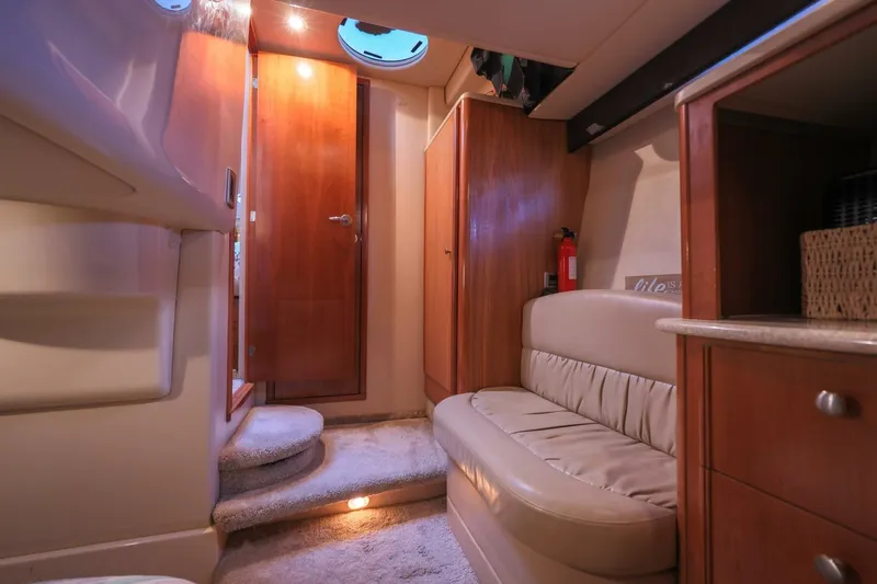 My Gypsy Soul Yacht Photos Pics Interior of 2004 Meridian 411 Sedan yacht, featuring cozy seating and wooden cabinetry.