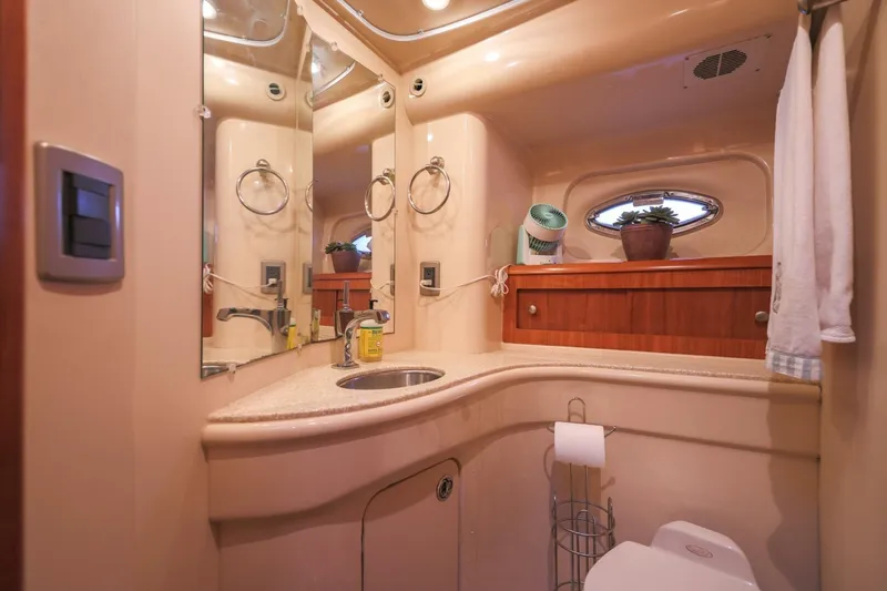 My Gypsy Soul Yacht Photos Pics Luxurious bathroom in 2004 Meridian 411 Sedan yacht with modern fixtures and elegant design.