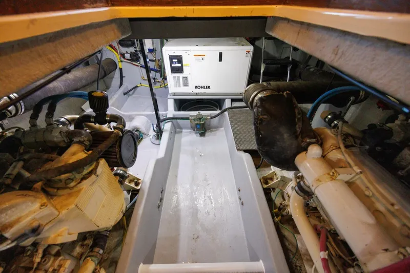 My Gypsy Soul Yacht Photos Pics Engine room of 2004 Meridian 411 Sedan with Kohler generator and mechanical components.