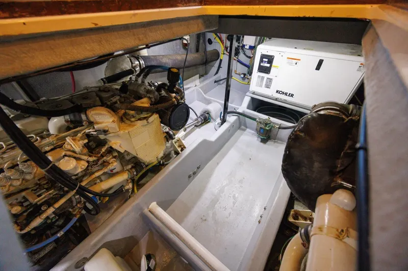 My Gypsy Soul Yacht Photos Pics Engine room of 2004 Meridian 411 Sedan with Kohler generator and mechanical components.