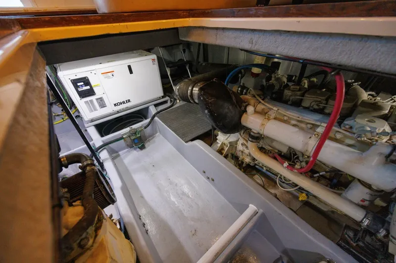 My Gypsy Soul Yacht Photos Pics Engine room of 2004 Meridian 411 Sedan with Kohler generator and mechanical components.
