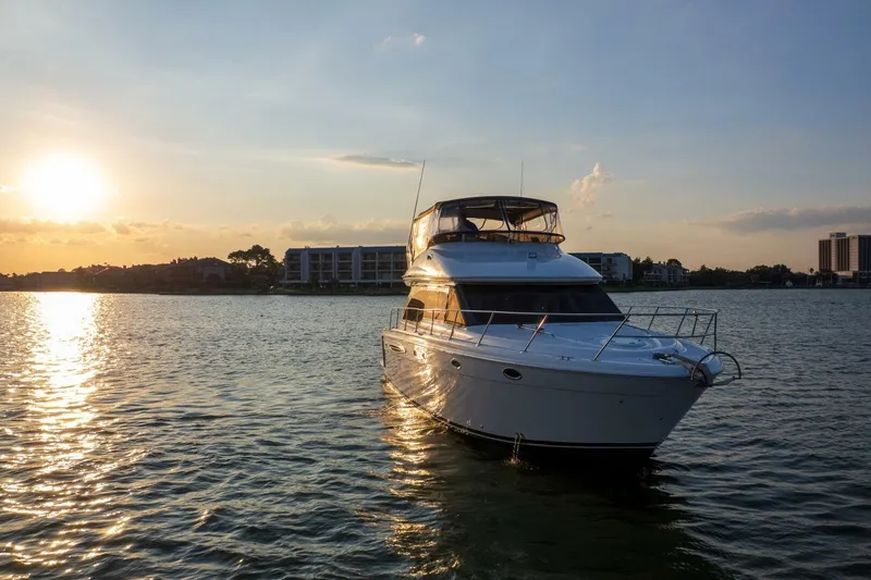 My Gypsy Soul Yacht Photos Pics 2004 Meridian 411 Sedan yacht on serene water at sunset.