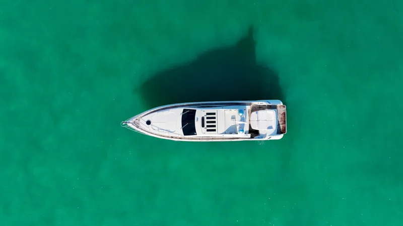  Yacht Photos Pics Aerial view of 2006 Azimut 68S yacht on turquoise water.