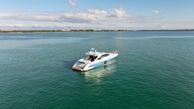  Yacht Photos Pics Azimut 68S 2006 yacht on calm blue water under a clear sky.