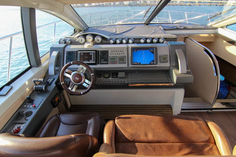  Yacht Photos Pics 2006 Azimut 68S yacht helm with leather seats and advanced navigation controls.