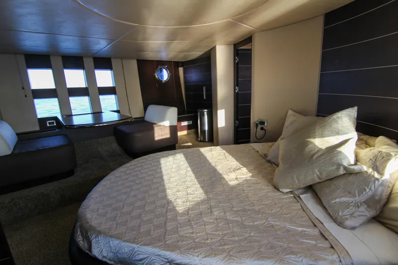  Yacht Photos Pics Luxurious interior of 2006 Azimut 68S yacht featuring a spacious bedroom with modern design.