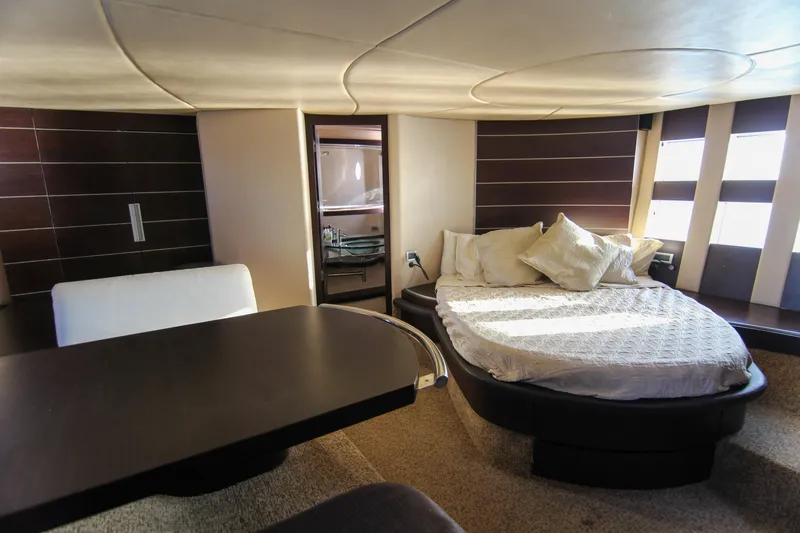  Yacht Photos Pics Luxurious interior of 2006 Azimut 68S yacht with modern bedroom and elegant furnishings.