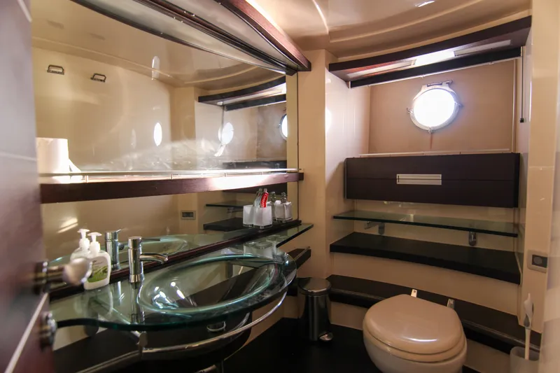  Yacht Photos Pics Luxurious bathroom in 2006 Azimut 68S yacht with modern fixtures and glass sink.