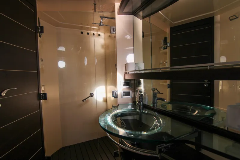  Yacht Photos Pics Luxurious bathroom in 2006 Azimut 68S yacht with modern glass sink and shower.