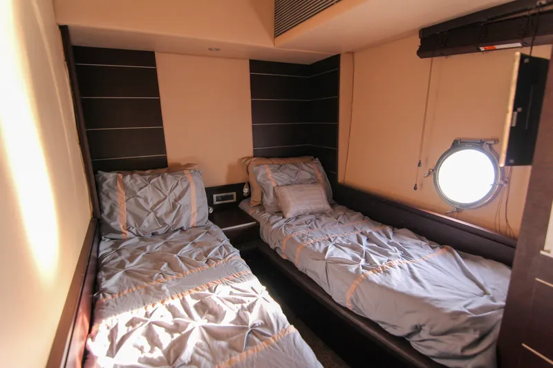  Yacht Photos Pics Twin cabin interior of 2006 Azimut 68S yacht with porthole window.