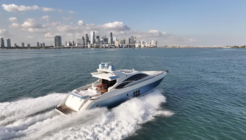  Yacht Photos Pics Azimut 68S yacht cruising near city skyline, 2006 model.