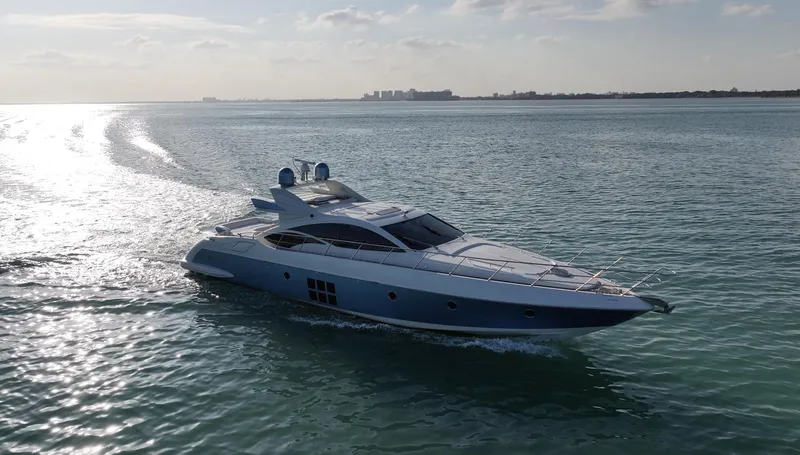  Yacht Photos Pics Luxury 2006 Azimut 68S yacht cruising on calm ocean waters.