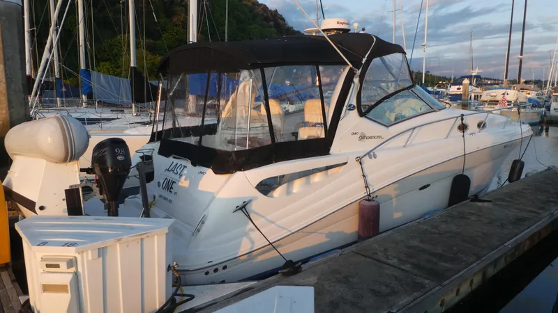  Yacht Photos Pics 2007 Sea Ray 340 Sundancer docked at marina, featuring sleek design and black canopy.