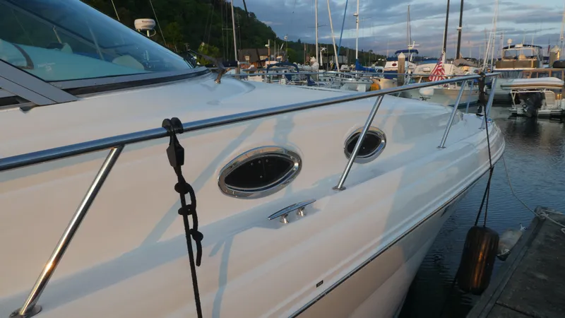  Yacht Photos Pics 2007 Sea Ray 340 Sundancer docked at marina, side view with portholes.