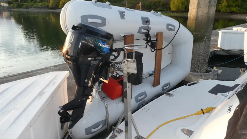  Yacht Photos Pics Inflatable boat with outboard motor docked beside 2007 Sea Ray 340 Sundancer.
