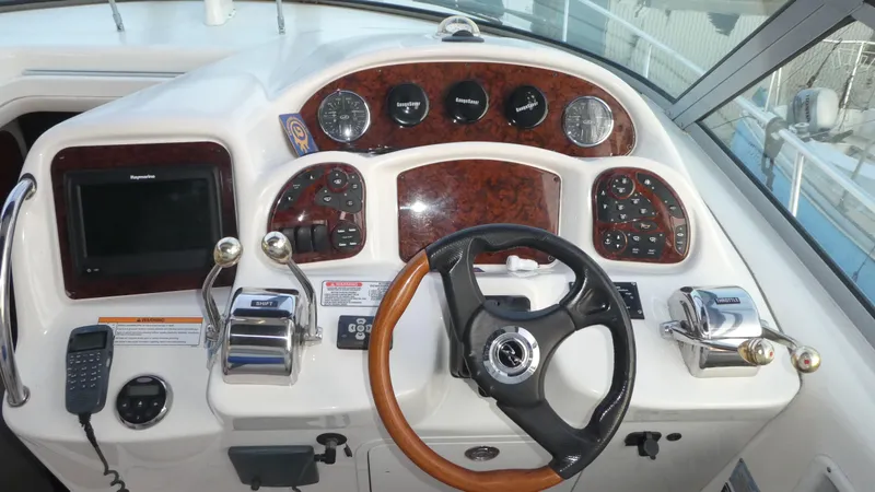  Yacht Photos Pics 2007 Sea Ray 340 Sundancer helm with wood accents and modern controls.
