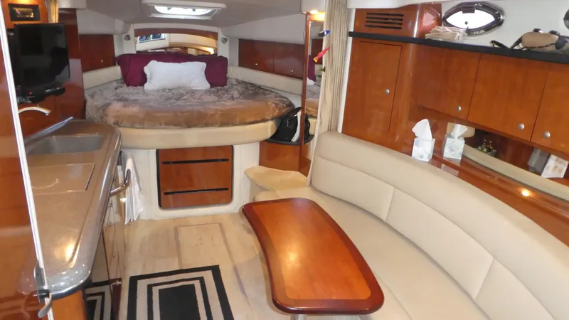 Yacht Photos Pics Interior of 2007 Sea Ray 340 Sundancer yacht with cozy seating and elegant wood finishes.