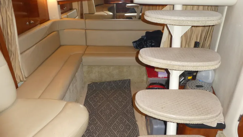  Yacht Photos Pics Interior of 2007 Sea Ray 340 Sundancer with beige seating and spiral staircase.