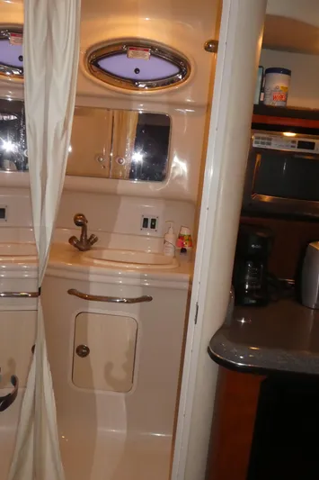  Yacht Photos Pics 2007 Sea Ray 340 Sundancer interior with kitchenette and bathroom sink.