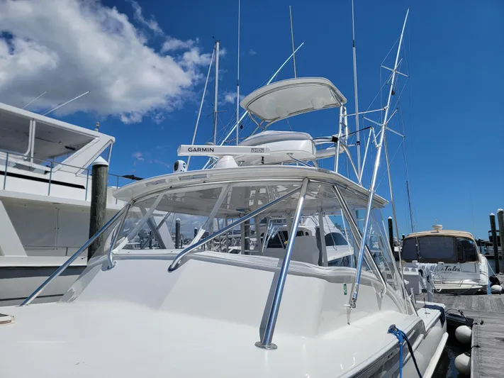  Yacht Photos Pics 2010 Jersey Cape Devil 36 boat docked at marina under blue sky.