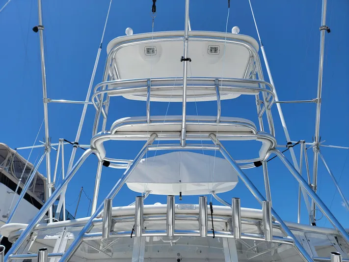  Yacht Photos Pics 2010 Jersey Cape Devil 36 boat tower and outriggers against blue sky.