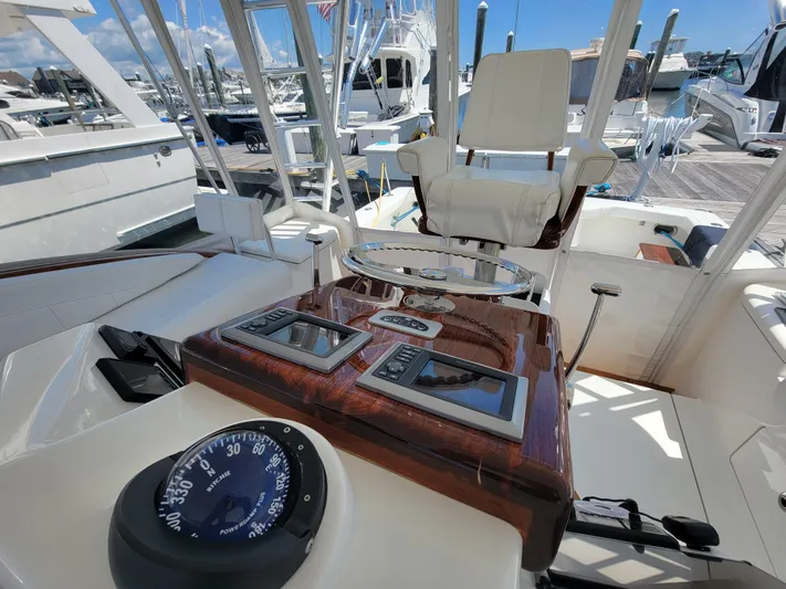  Yacht Photos Pics 2010 Jersey Cape Devil 36 boat helm with navigation instruments and captain's chair.