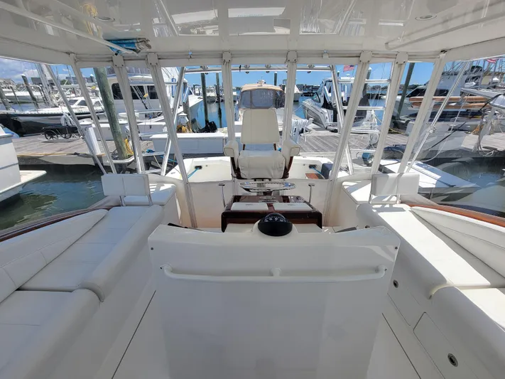  Yacht Photos Pics 2010 Jersey Cape Devil 36 boat interior with white seating and helm station.