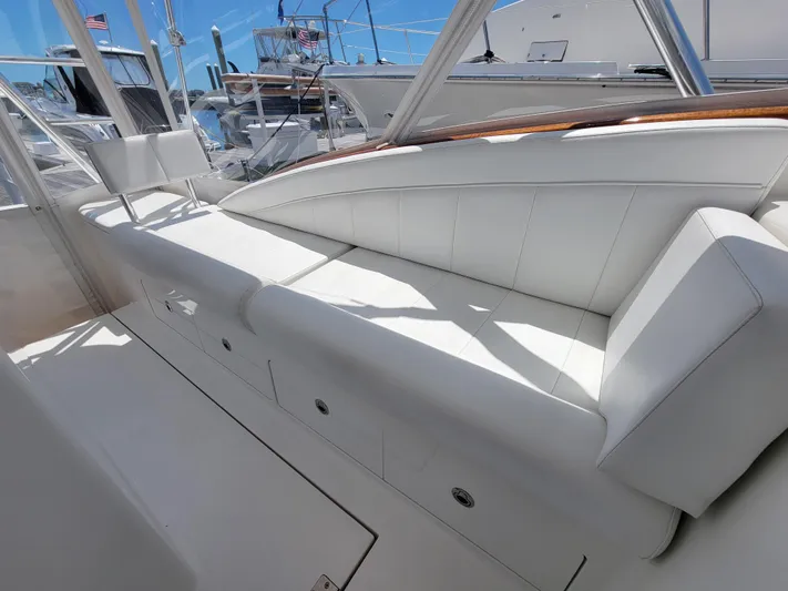  Yacht Photos Pics 2010 Jersey Cape Devil 36 boat with white leather seating in the cockpit area.