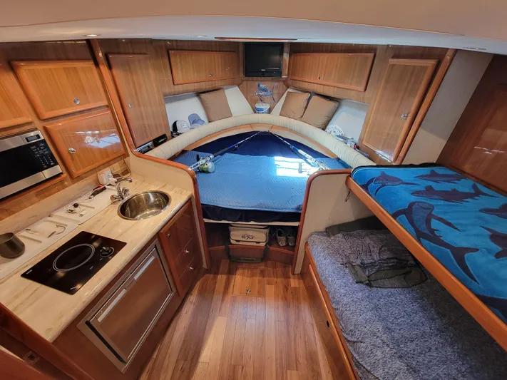  Yacht Photos Pics Interior of 2010 Jersey Cape Devil 36 boat with kitchen and sleeping area.
