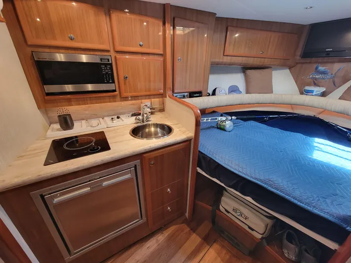  Yacht Photos Pics 2010 Jersey Cape Devil 36 interior with kitchen and sleeping area