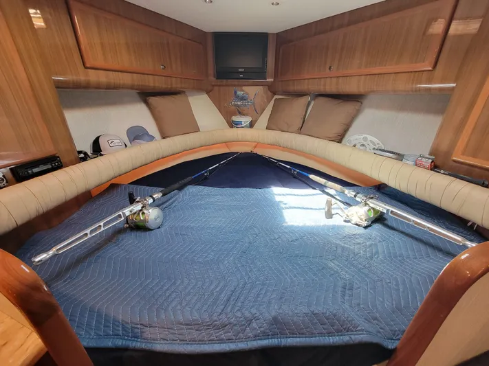 Yacht Photos Pics Interior cabin of 2010 Jersey Cape Devil 36 boat with fishing rods.