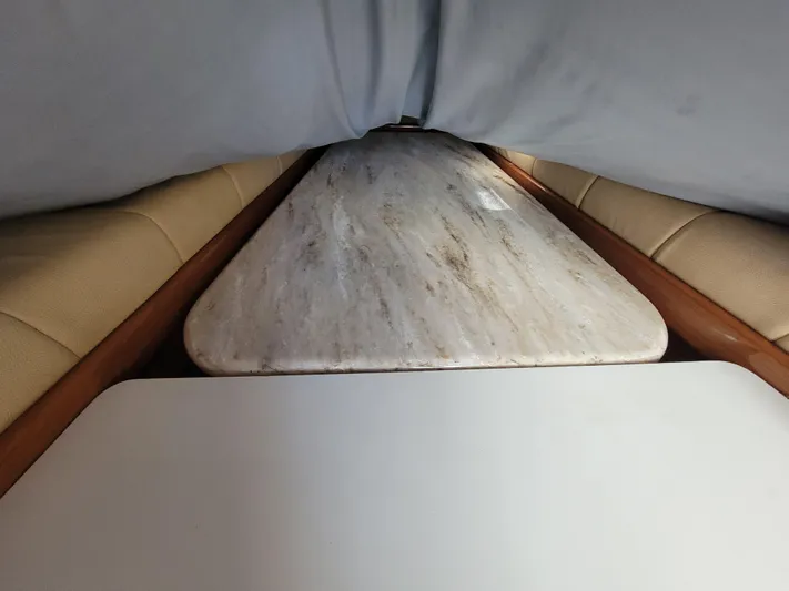  Yacht Photos Pics Interior cabin of 2010 Jersey Cape Devil 36 with seating and table.