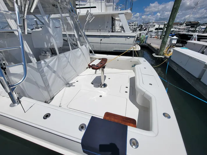  Yacht Photos Pics 2010 Jersey Cape Devil 36 boat docked, featuring spacious deck and fishing chair.